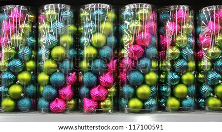 colorful glitter Christmas balls in boxes