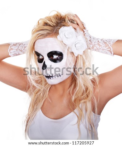 skull makeup on young girl with white roses and lace gloves for Halloween isolated on white