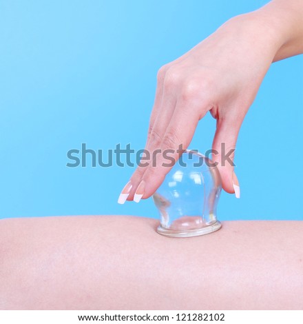 vacuum massage therapy over blue background, cupping