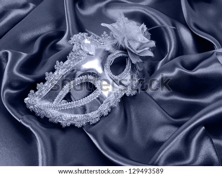 shiny carnival masks on silk fabric
