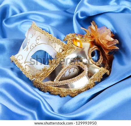 carnival masks,  gold glitter mack on turquoise silk fabric