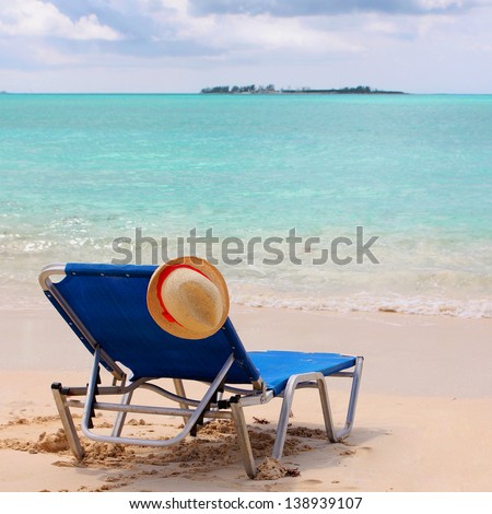 beach with sun lounge and turquoise ocean. vacation on the Bahamas