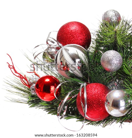 Christmas Decoration. Red and Silver Balls on Christmas tree branch isolated on white background. Holiday Card