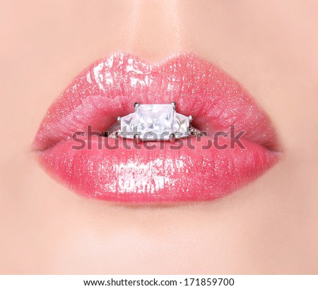 Sexy Lips with Diamond Ring. Beauty Pink Lip Gloss. Mouth with engagement gold ring. Makeup. Closeup.