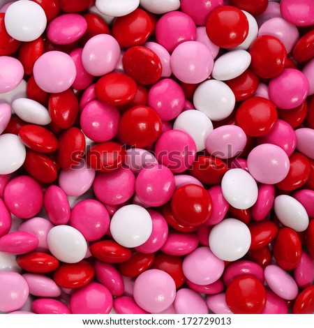 Colorful Chocolate Valentine\'S Candy Coated In Pink, Red And White. Background