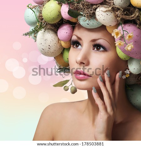 Easter Woman. Spring Girl with Fashion Hairstyle. Portrait of Beautiful Model with Colorful Eggs. Pastel Colors.