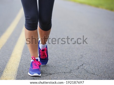 Runner Female Feet Running on Road. Jog