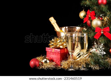 Christmas or New Year\'s Eve. Champagne and Presents over Black Background. Celebration