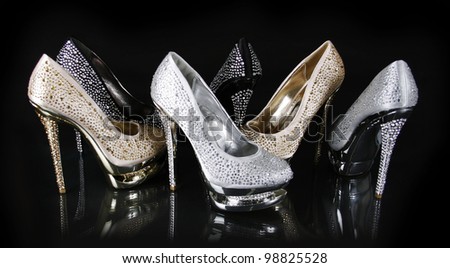 crystals encrusted shoes collection on black background