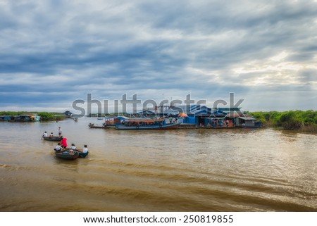 SIEM REAP, CAMBODIA DEC. 16: Cambodian people live on Tonle Sap Lake in Siem Reap, Cambodia on December 16, 2011. The floating village on the water (komprongpok) of Tonle Sap lake.