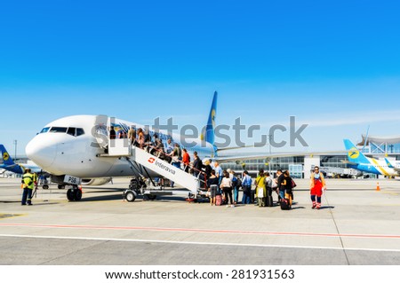 Ukraine, Borispol - MAY 22 : Passengers of the ladder landing at Boeing 737 at the international airport Borispol on May 22, 2015 in Borispol, Ukraine