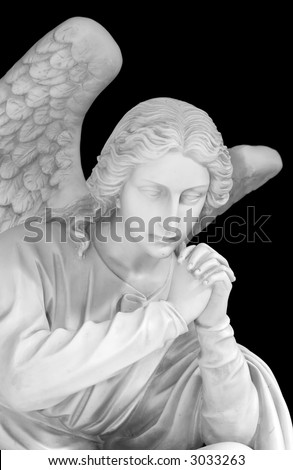 Marble sculpture of a guardian angel isolated on a black background