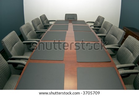 A fisheye shot of a small conference room vacant of activity with copy space available.
