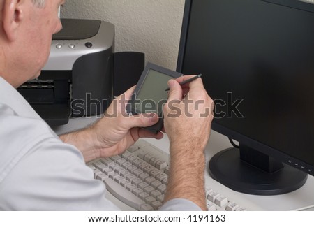 A man with an electronic device in his hand getting ready to record some data.