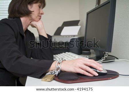 woman chained to her desk