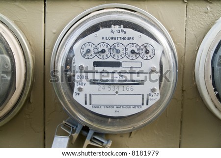A close up of a kilowatt hour single stator power company meter.