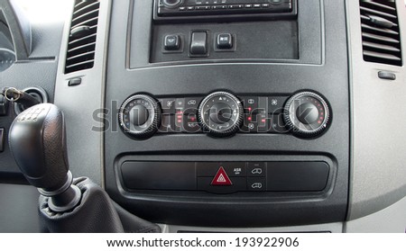 Car interior detail. Closeup of air control panel inside of mini passenger bus