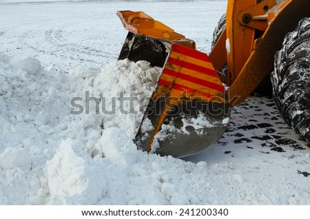 Clearing the road from snow. Winter in Russia