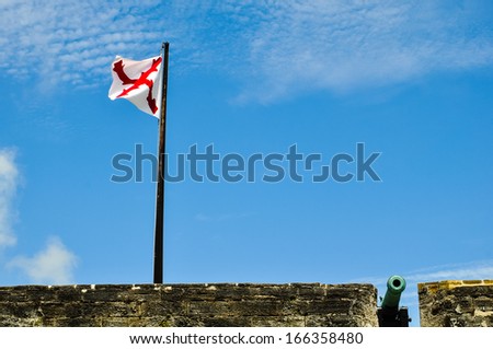 flag and cannon at historical castillo de san marcos, saint augustine, florida