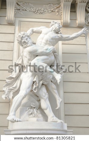 antique statue of two greek male gods wrestling each other