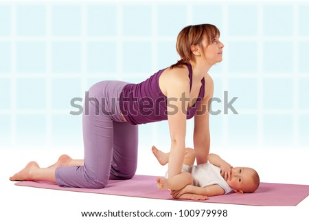 Yoga for woman and child / Mother and her baby doing yoga exercise