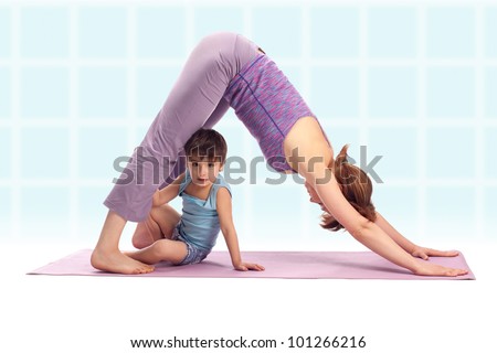 Yoga / Mother and her son doing yoga exercise