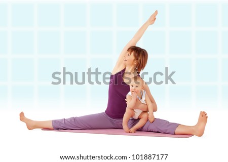 Yoga / Mother with her baby doing yoga exercise