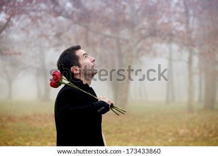 Man with red roses