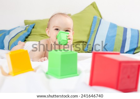 Baby girl playing with cube toys