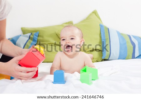 Baby girl playing with cube toys