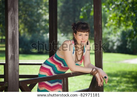Girl relaxing in nature / Beautiful girl in the park house relaxing