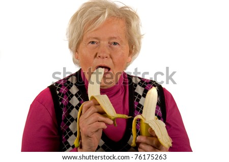stock-photo-senior-lady-is-eating-bananas-76175263.jpg