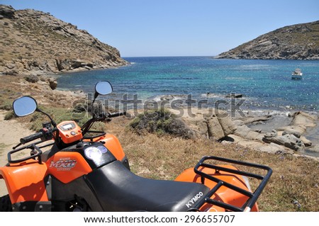 Mykonos, Greece - May 31, 2013: Kymco quad bike or ATV is parked by Mykonos waterfront. Tourists normally rent quad bike and drive around Mykonos island.