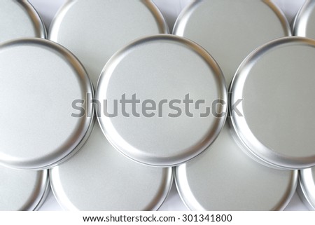 Many round tin boxes from top view