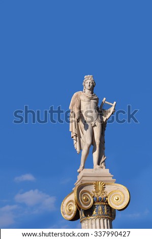 Statue of Apollo on top of a pillar in front Academy of Athens, Greece