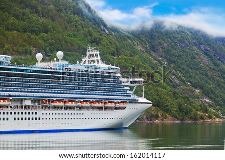 Cruise liner in Geiranger fjord Norway - nature and travel background