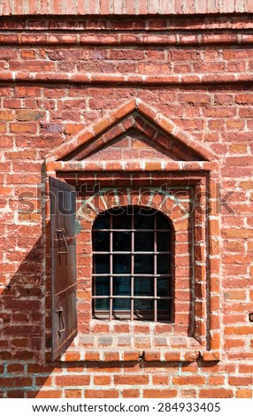 Old window in brick wall - Krutitskoe Compound Cathedral in Moscow Russia