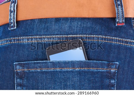 Jeans and mobile phone isolated on white background