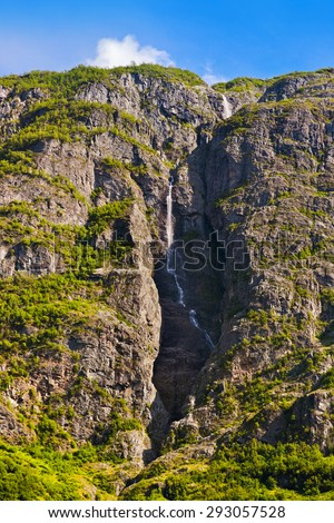 Waterfall in fjord Sognefjord - Norway - nature and travel background
