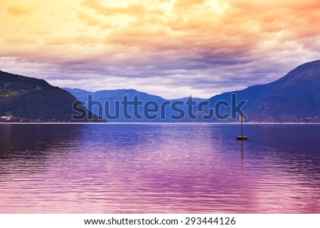 Sunset in fjord Hardanger Norway - nature and travel background