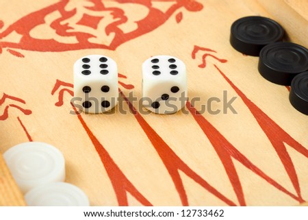 Macro of retro backgammon game and dices, isolated on white background