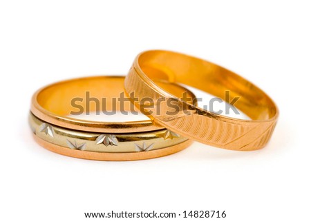 stock photo Gold wedding rings isolated on white background