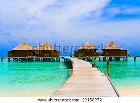 Water bungalows at a tropical island - travel background