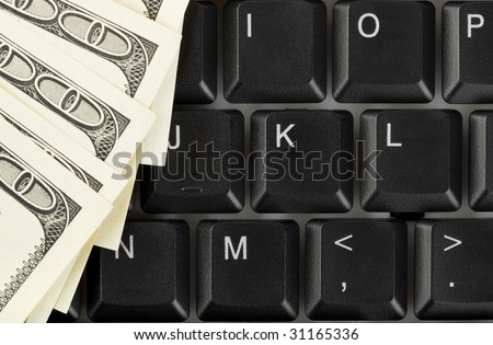 Computer keyboard and money - concept business background