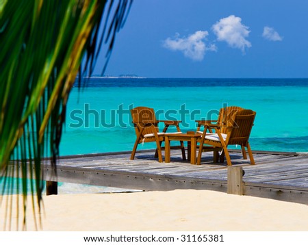 Cafe on the beach, ocean and sky - vacations background