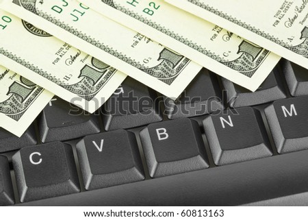 Computer keyboard and money - concept business background