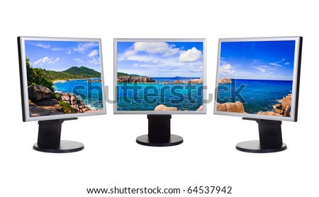 Panorama of coast (my photo) on computer screens isolated on white background