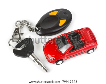 Toy car and keys isolated on white background