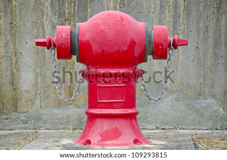 Red fire hydrant over the wall