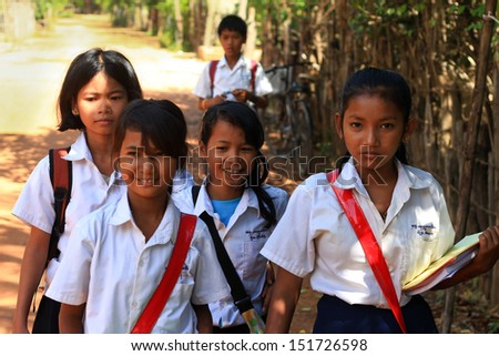 SIEM REAP,CAMBODIA-NOVEMBER 16: A group of unidentified school girls returning from school in a small village near Siem Reap on November 16, 2010, Cambodia. Education began making a slow comeback.